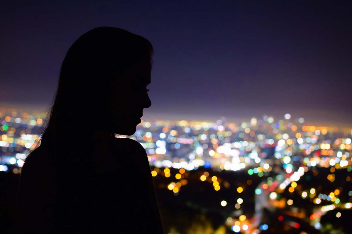 mulholland drive woman's silhouette in front of building los angeles